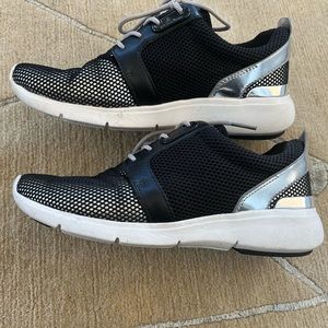 Black and silver Michael Kors athletic shoes. Size 7. Only worn a few times.